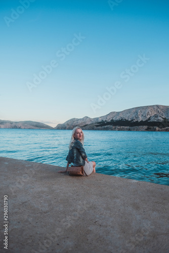young woman on the beach by the sea with mountain view © Zuzana Mrázová
