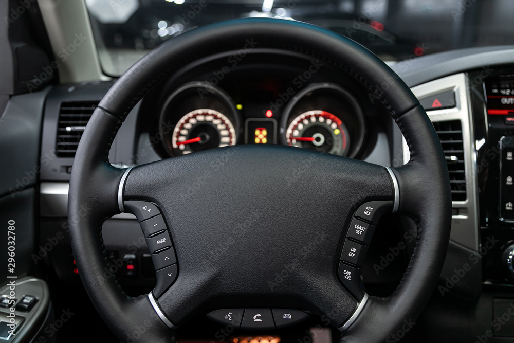 close-up of the dashboard, speedometer, tachometer and steering wheel. . modern car interior.