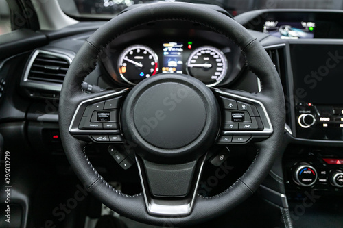 close-up of the dashboard, speedometer, tachometer and steering wheel. . modern car interior.