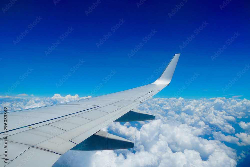 flying and traveling, Clouds and sky as seen through window of an aircraft, view from airplane window on the wing
