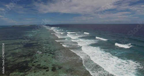 Wallpaper Mural Aerial view above the Indian Ocean waves in seashore in Maldives or Seychelles.  Foamy waves in the middle of the turquoise tropical ocean.  Torontodigital.ca