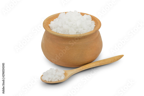 Closeup pure rock natural sea salt in ceramic  bowl isolated on white background. Clipping path. photo