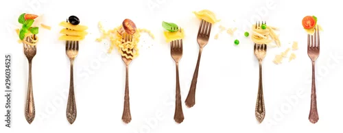 Obraz  z motywem Italian food collage. Pasta design elements. Many forks with pasta and various addings, shot from the top on a white background