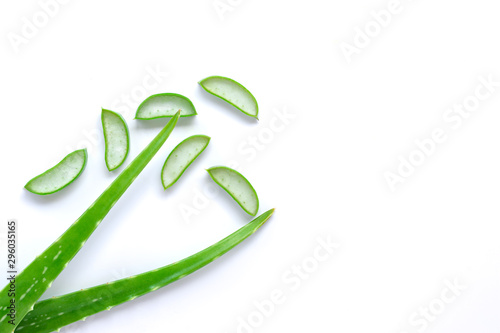 Green fresh aloe vera leaves and slices  isolated on white background. Top view.