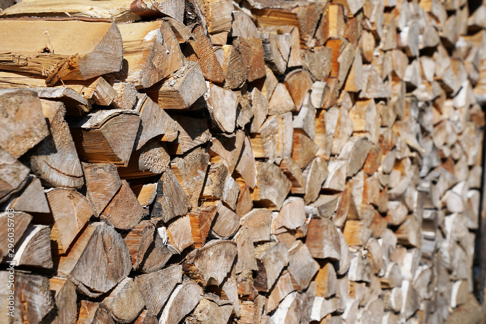 harvesting firewood stacked tightly to each other on a Sunny day harvesting firewood stacked tightly to each other on a Sunny day