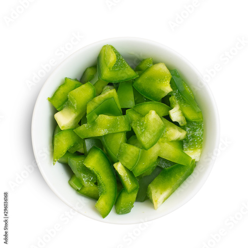 Slika na platnu Chopped green pepper in bowl isolated on white background