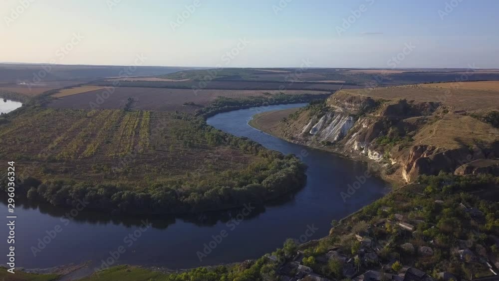 Flight over the river and small village in autumn. Moldova republic of. Molovata village. River Dniester. Flight over the river and small village in autumn. Moldova republic of. Molovata village. River Dniester.