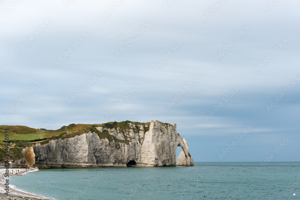 the Falaises of Etretat rock cliffs and beach on the coast of Normandy