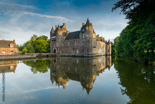 historic Chateau Trecesson castle in the Broceliande Forest with reflections in the pond