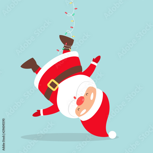 Santa Claus in red clothes hanging on garland