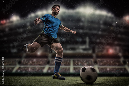 Football player with ball on field of stadium © romanolebedev