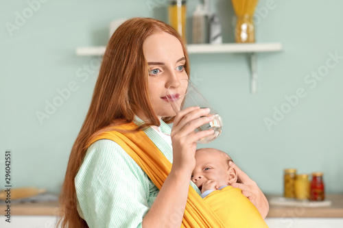 Young mother with little ba...