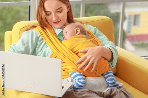 Young mother with little ba...