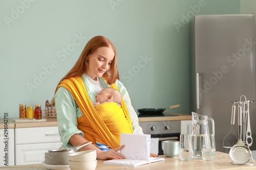 Young mother with little ba...