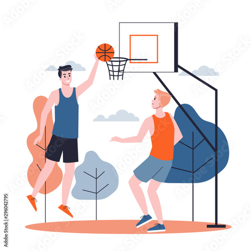 Man in the sport uniform playing basketball on the street