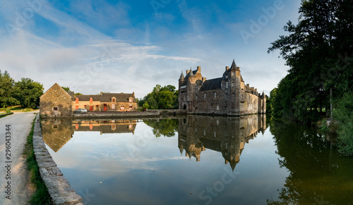 view of the historic Chateau Trecesson castle in the Broceliande Forest with reflections in the pond
