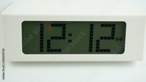 Digital alarm White clock time 12.12 am or pm on white background, Time concept.