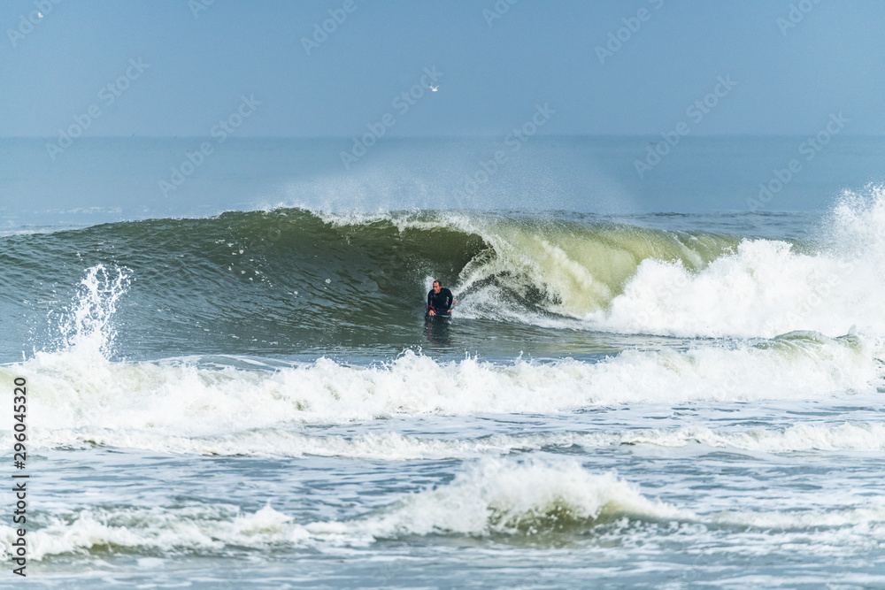 Bodyboarder surfing ocean wave Bodyboarder surfing ocean wave