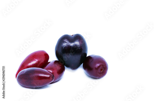 Cornus mas or Cornelian cherry fruit isolated on white background