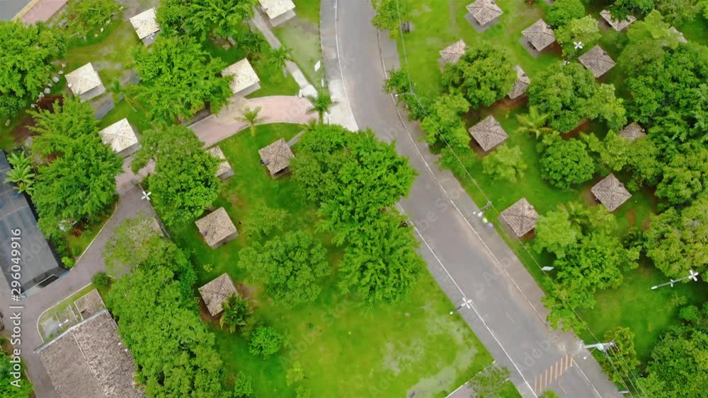 Top View Of The Highway Between A Park With A Small Cottage And Tree - Forwards Top View Of The Highway Between A Park With A Small Cottage And Tree - Forwards