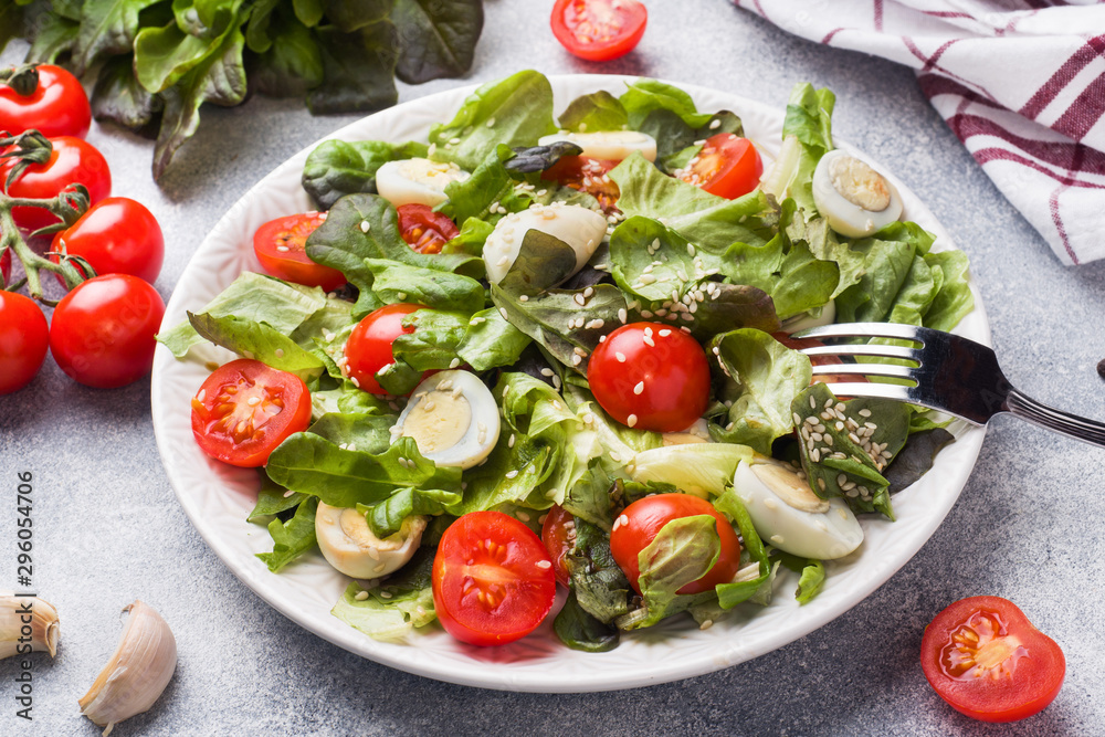 Fresh salad with tomatoes and quail eggs and lettuce. Fresh salad with tomatoes and quail eggs and lettuce.