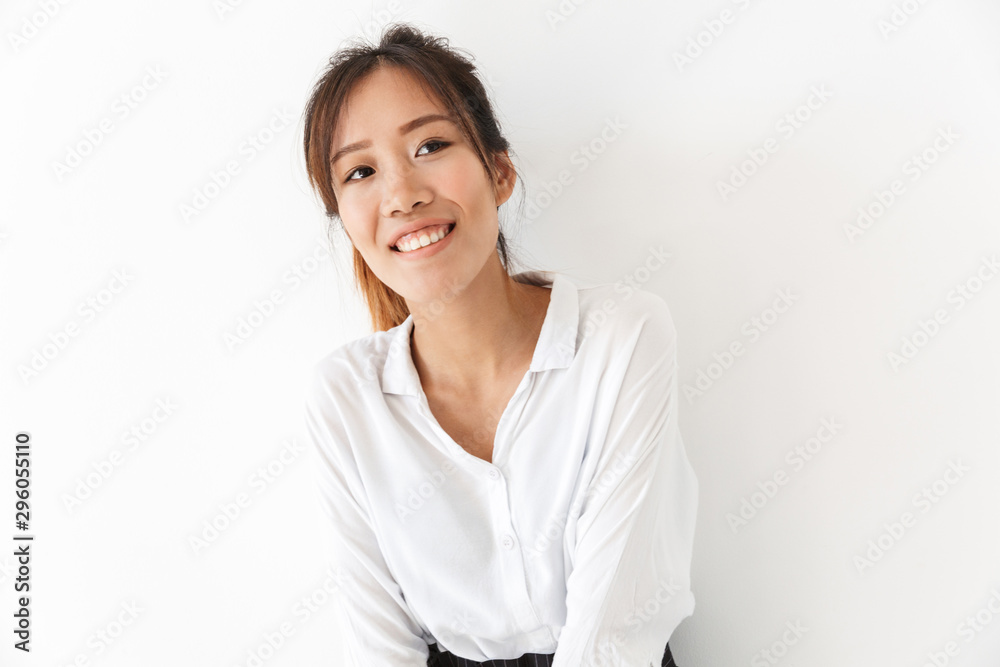 Attractive smiling asian woman standing isolated Attractive smiling asian woman standing isolated