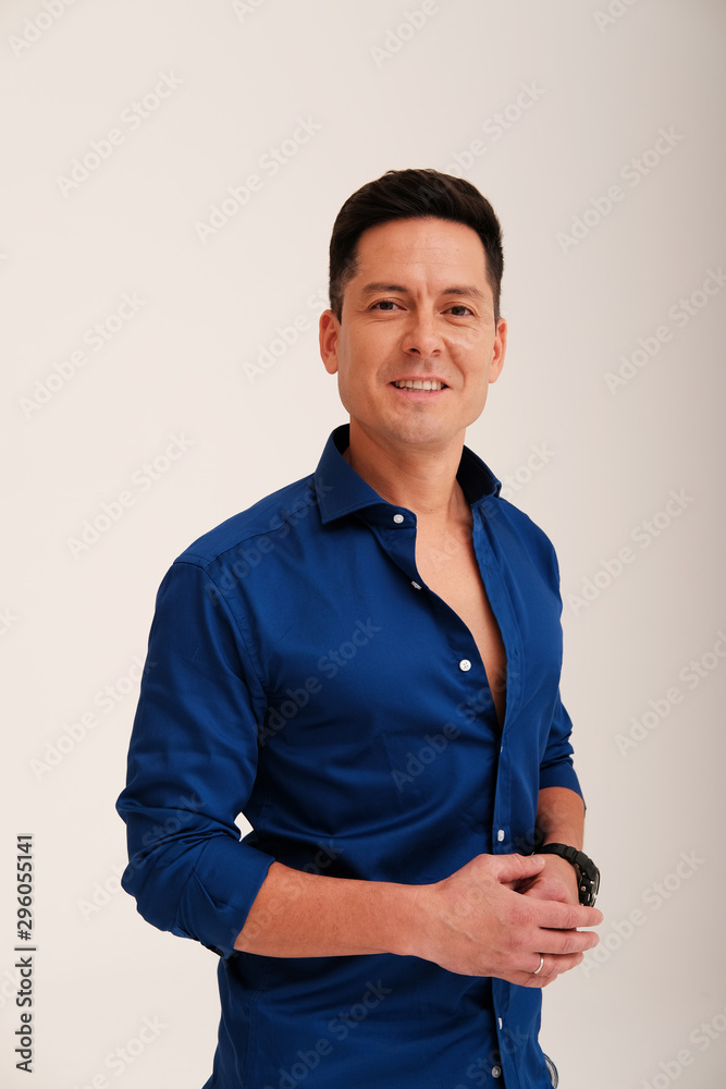 Studio portrait of handsome man in blue shirt Studio portrait of handsome man in blue shirt