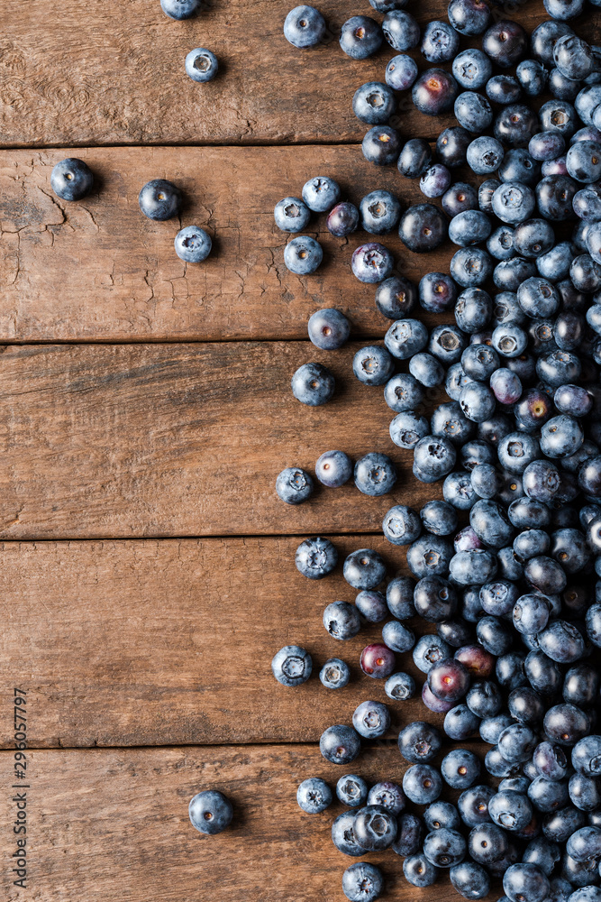 Overhead shot of fresh blueberries on wooden table. Top view Overhead shot of fresh blueberries on wooden table. Top view