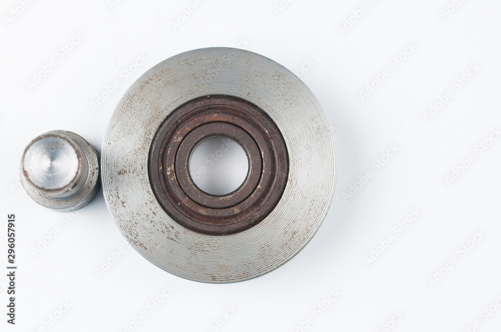 Small steel pulley isolated on white background.Copy space Small steel pulley isolated on white background.Copy space