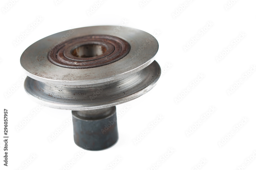 Small steel pulley isolated on white background.Copy space Small steel pulley isolated on white background.Copy space