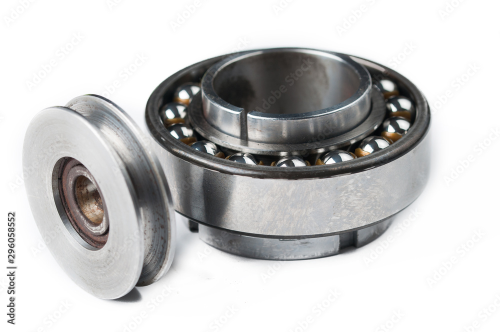 Ball bearing and pulley isolated on white background.Copy space Ball bearing and pulley isolated on white background.Copy space