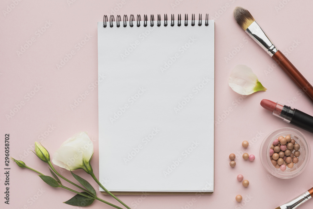 Top view arrangement with make-up products and notebook Top view arrangement with make-up products and notebook