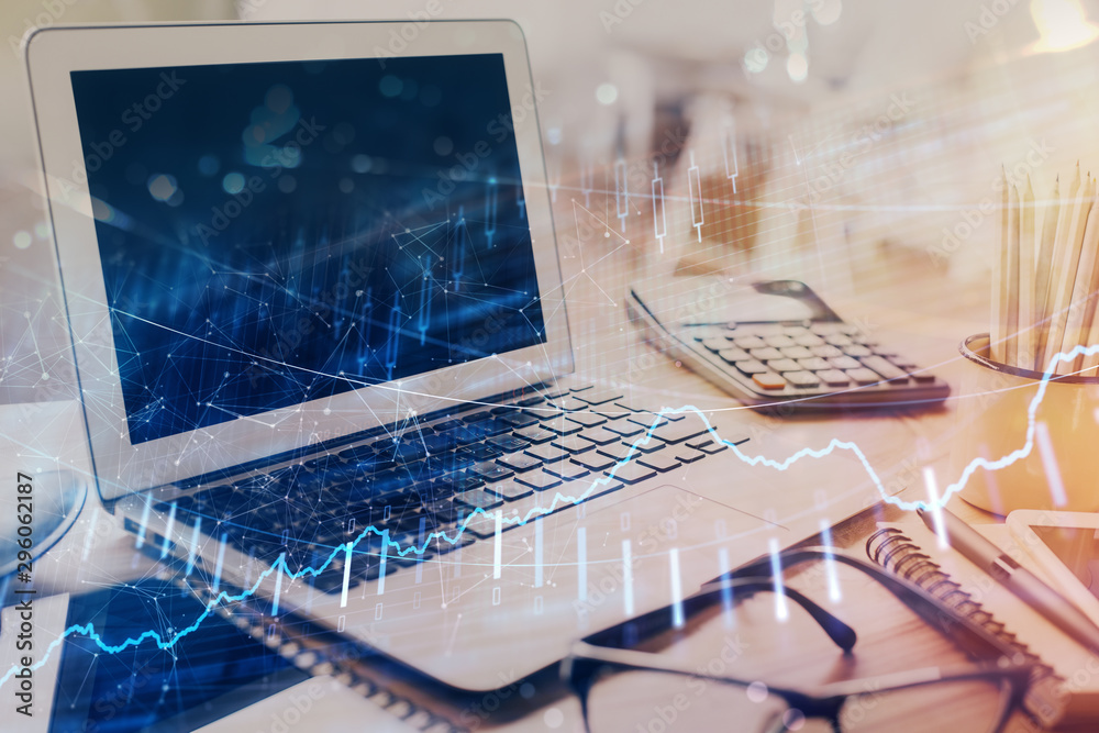 Stock market graph on background with desk and personal computer. Multi exposure. Concept of financial analysis. Stock market graph on background with desk and personal computer. Multi exposure. Concept of financial analysis.