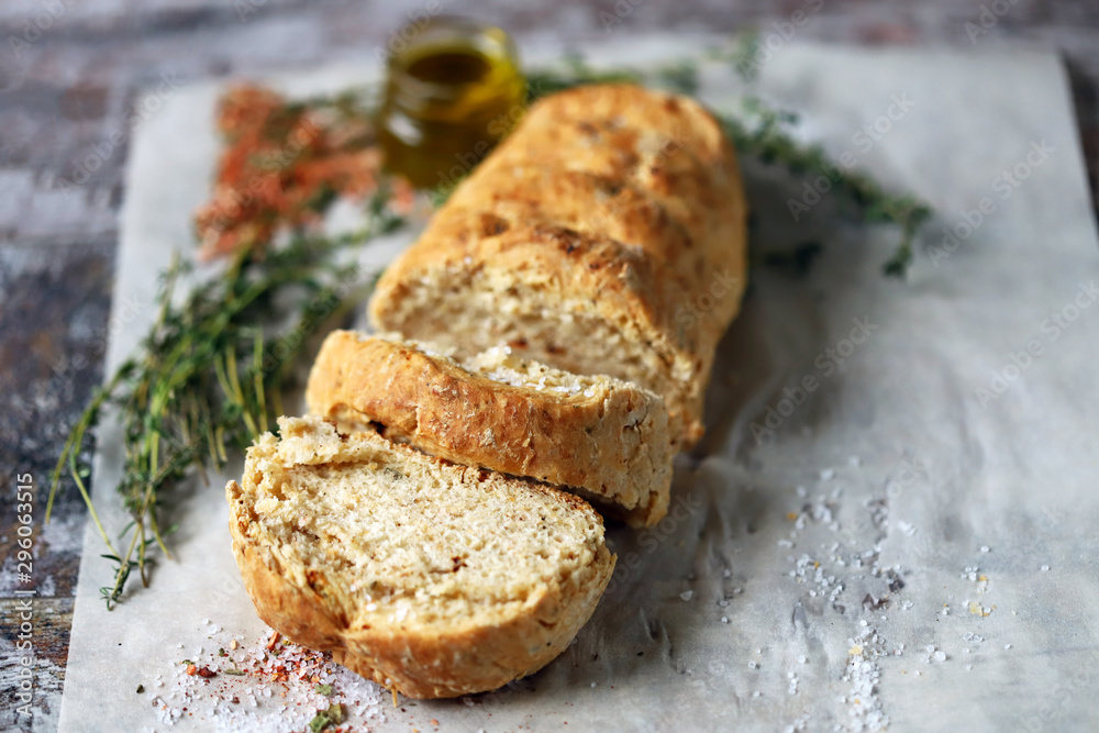 Fresh homemade italian bread with herbs and spices. Selective focus. Macro. Fresh homemade italian bread with herbs and spices. Selective focus. Macro.