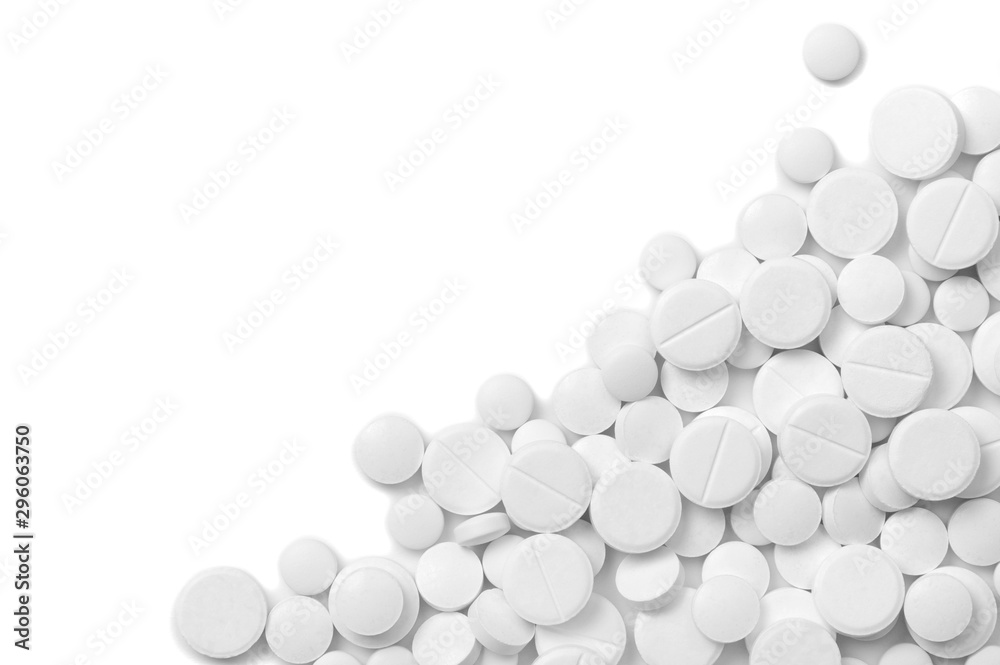 Heap of pills on white