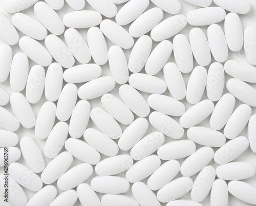 White pills (tablets) background. Top view © Alekss