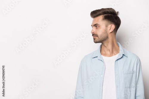 Caucasian young man in profile look at copy space