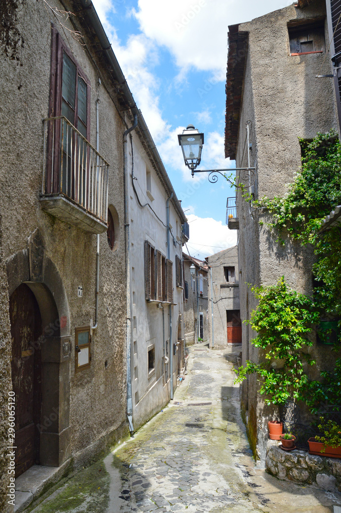 Province of Salerno, Italy, 05/27/2017. A narrow street among the old houses of a mountain village.