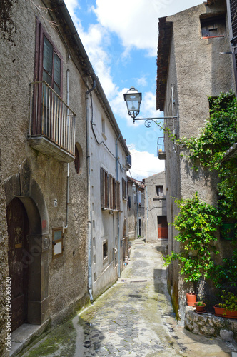 Province of Salerno, Italy, 05/27/2017. A narrow street among the old houses of a mountain village.