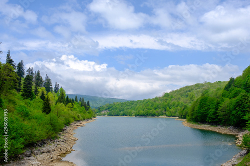 Scenic view on beautiful lake in front and mountain landscape in background