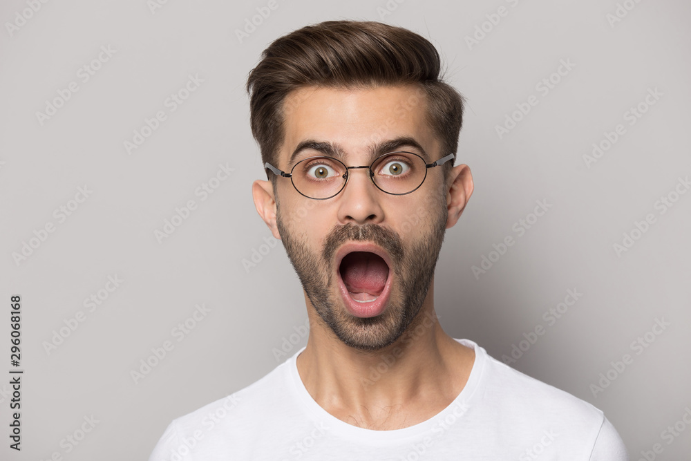 Caucasian man in glasses shocked by unexpected news Caucasian man in glasses shocked by unexpected news