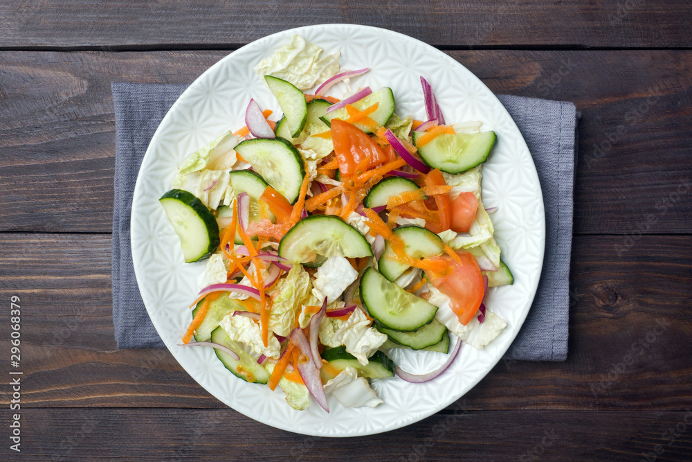 Vegetarian salad of raw fresh vegetables in a plate. Concept healthy eating Copy space
