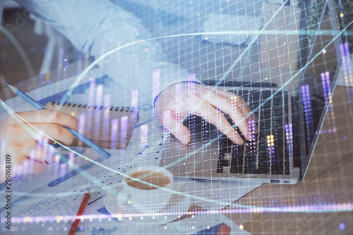 Wallpaper Mural Forex graph with businessman working on computer in office on background. Concept of hardworking. Multi exposure. Torontodigital.ca