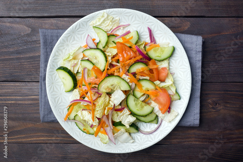 Vegetarian salad of raw fresh vegetables in a plate. Concept healthy eating Copy space