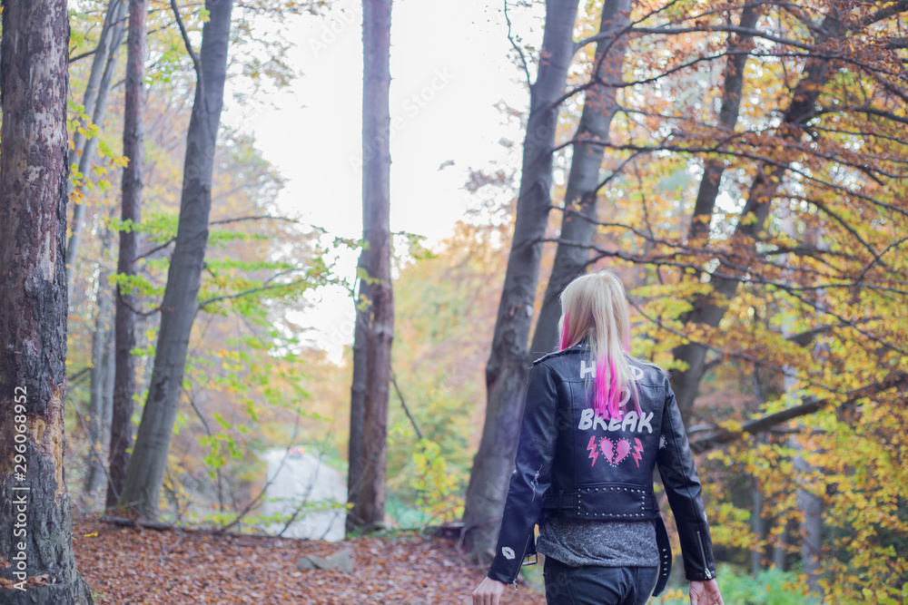 Outdoor autumn portrait of beautiful young woman with pink hair Outdoor autumn portrait of beautiful young woman with pink hair