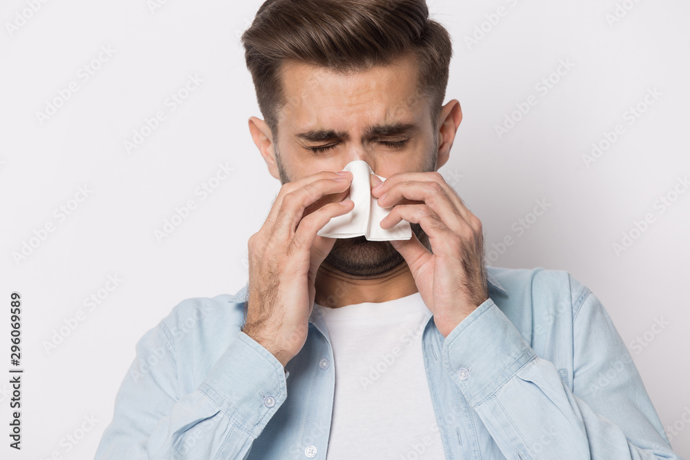 Unhealthy caucasian man blow nose suffer from flu Unhealthy caucasian man blow nose suffer from flu