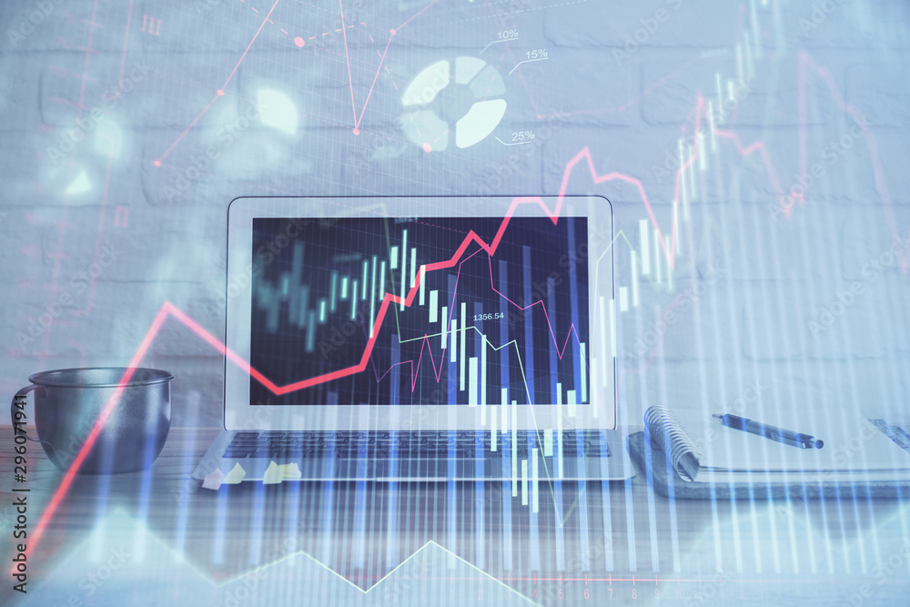 Stock market graph on background with desk and personal computer. Double exposure. Concept of financial analysis. Stock market graph on background with desk and personal computer. Double exposure. Concept of financial analysis.