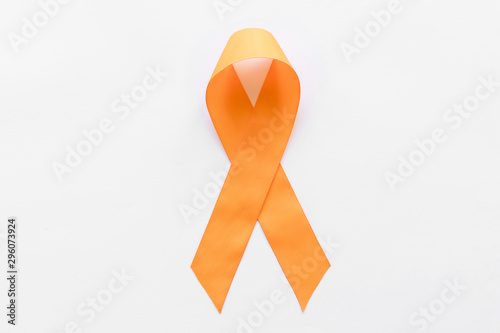 Orange ribbon for raising awareness on leukemia, kidney cancer RDS multiple sclerosis, and ADHD illness photo