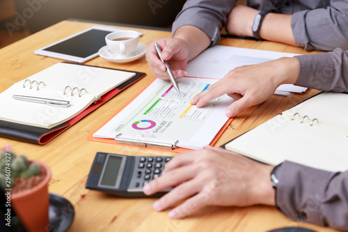 Small and Medium Enterprise Business concept of ,Businessman using calculator to calculate Assets Chart