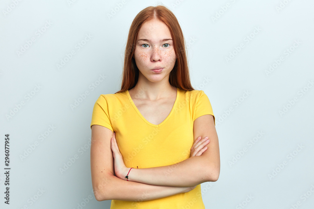 Closeup portrait displeased annoyed angry frustrated woman with bad attitude, arms crossed looking at camera , isolated white background. Negative human emotion facial expression feeling Closeup portrait displeased annoyed angry frustrated woman with bad attitude, arms crossed looking at camera , isolated white background. Negative human emotion facial expression feeling